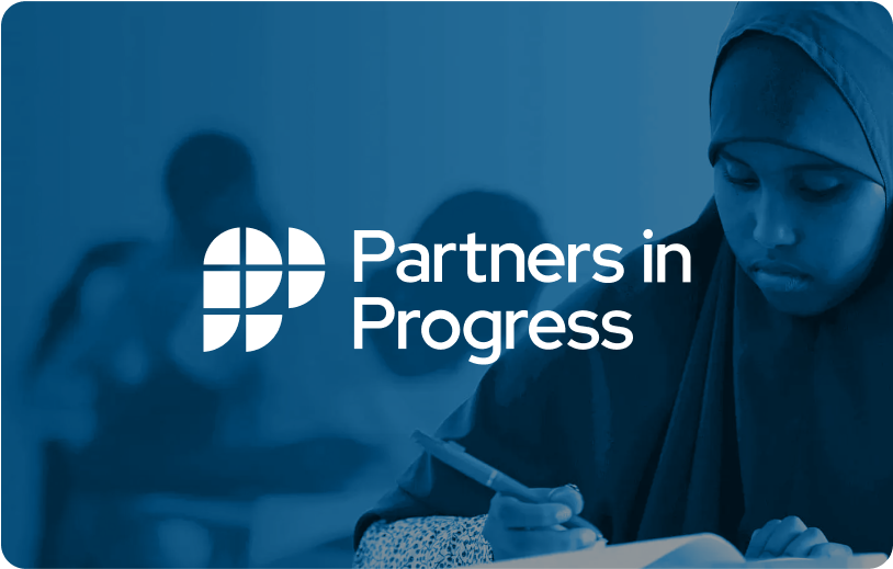 A student writing, with the "Partners in Progress" logo
